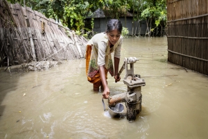 During the 2016 floods in Kurigram, northern Bangladesh, a girl tries to pump clean water from a standpipe. The contamination of drinking water supplies is a major risk during flooding. Most disasters are water-related